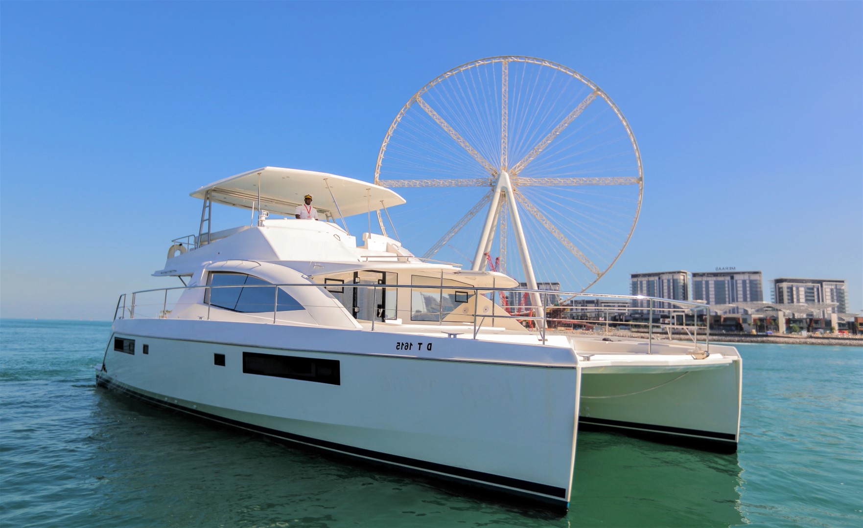 catamaran with ain wheel on background
